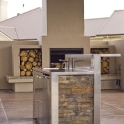 View of kitchens designed by Kira Gray of countertop, floor, flooring, interior design, kitchen, brown, white