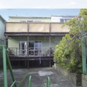 A view of a home before it was apartment, facade, house, property, real estate, residential area, white, gray