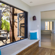 A view of the hallway, wooden flooring, bay door, estate, floor, home, house, interior design, property, real estate, window, gray