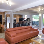 A view of a home renovated by Logic home, interior design, living room, property, real estate, room, gray, red