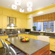 view of kitchen featuring lighting, yellow cabinetry, countertops, ceiling, countertop, estate, home, interior design, kitchen, real estate, room, window, yellow, orange