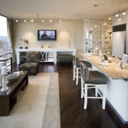 View of living space in the X/O development. floor, flooring, furniture, interior design, living room, room, gray