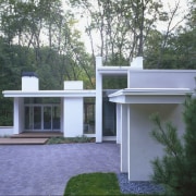 View of a house designed by Charles R architecture, backyard, cottage, estate, facade, grass, home, house, outdoor structure, plant, property, real estate, residential area, roof, tree, yard, black