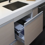 View of kitchen designed by Yellowfox. - View bathroom, bathroom accessory, bathroom cabinet, cabinetry, countertop, drawer, floor, furniture, kitchen, product, product design, sink, tap, gray, black