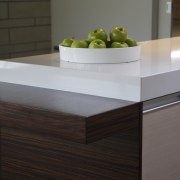 View of kitchen designed by Yellowfox. - View chest of drawers, coffee table, countertop, drawer, floor, flooring, furniture, hardwood, table, wall, wood, wood stain, gray, black