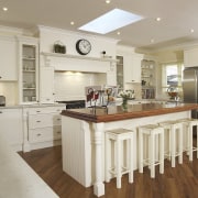 A view of a kitchen designed by Nouvelle cabinetry, countertop, cuisine classique, floor, flooring, hardwood, interior design, kitchen, real estate, room, wood flooring, gray