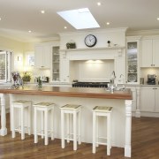 A view of a kitchen designed by Nouvelle cabinetry, ceiling, countertop, cuisine classique, floor, flooring, hardwood, home, interior design, kitchen, laminate flooring, property, real estate, room, wood flooring, gray