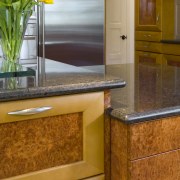 view of kitchen countertops and cabinetry. - view cabinetry, chest of drawers, countertop, drawer, floor, flooring, furniture, hardwood, interior design, kitchen, room, table, tile, wood flooring, wood stain, brown