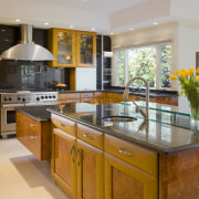 view of kitchen including cabinetry, granite countertops, tile cabinetry, countertop, cuisine classique, estate, interior design, kitchen, real estate, room, gray, brown