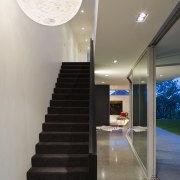 A vista from the entrance to the southern architecture, ceiling, daylighting, floor, handrail, home, house, interior design, lighting, stairs, gray