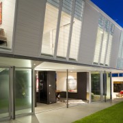 Exterior view of contemporary home featuring doors and architecture, building, commercial building, corporate headquarters, daylighting, facade, home, house, mixed use, real estate, window