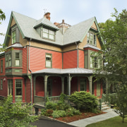 An exterior view of the entrance way to architecture, building, cottage, elevation, estate, facade, farmhouse, historic house, home, house, mansion, neighbourhood, outdoor structure, property, real estate, residential area, roof, siding, brown