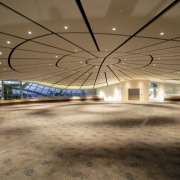 View of inside Auckland's Museum's Grand Atrium, with architecture, ceiling, convention center, daylighting, infrastructure, leisure centre, light, line, sky, structure, brown