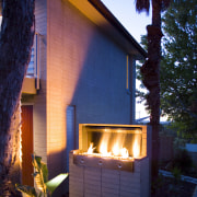 view of outdoor fireplace from Real Fires. - architecture, backyard, cottage, facade, home, house, lighting, property, real estate, residential area, shed, siding, window, wood, blue