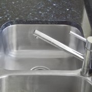 View of Kitchen by Apollo Bathroom &amp; Kitchen. hardware, plumbing fixture, sink, tap, gray, black