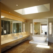 view of ensuite featuring travertine flooring, freestanding bath architecture, bathroom, ceiling, daylighting, estate, floor, flooring, hardwood, home, house, interior design, lighting, living room, lobby, real estate, room, tile, window, wood flooring, brown