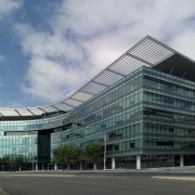 View of 7 London Circuit in Canberra. Leighton architecture, building, commercial building, condominium, convention center, corporate headquarters, daytime, facade, headquarters, metropolis, metropolitan area, mixed use, sky, skyscraper, tower block, gray, teal