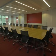 18 Marcus Clarke urban themed meeting room - auditorium, conference hall, desk, flooring, furniture, interior design, office, table, red, brown