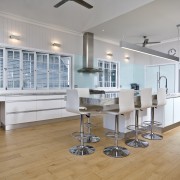 A view of a kitchen designed by KBDI. floor, flooring, hardwood, interior design, kitchen, property, real estate, room, wood flooring, gray