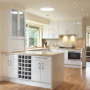 A view of a kitchen designed by a cabinetry, ceiling, countertop, cuisine classique, floor, flooring, hardwood, home, interior design, kitchen, laminate flooring, room, wood, wood flooring, gray