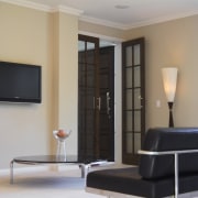 Living area inside contemporary home with interior design ceiling, floor, flooring, home, interior design, light fixture, lighting, living room, real estate, room, wall, window, wood, gray