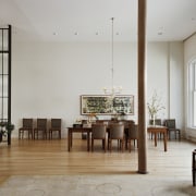 This once-derelict loft has been converted into a chair, dining room, floor, flooring, furniture, interior design, living room, room, table, gray