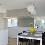 Kitchen and dining area inside contemporary home featuring apartment, architecture, ceiling, dining room, home, house, interior design, kitchen, property, real estate, room, gray