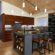view of kitchen including tiled splashback, wall tiles, countertop, floor, flooring, hardwood, interior design, kitchen, wood, wood flooring, orange