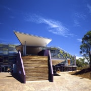 The strong goemetric lines of the entrance canopy architecture, estate, home, house, property, real estate, residential area, roof, sky, blue