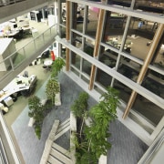 Four winter gardens were created, each three stories plant, window, gray