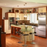 View of kitchen designs recommended by NKBA to cabinetry, countertop, cuisine classique, floor, flooring, hardwood, interior design, kitchen, real estate, room, wood flooring, brown, orange