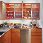 view of kitchen cabinetry, lightng, wooden flooring, sink, cabinetry, countertop, interior design, kitchen, orange, room, shelf, red