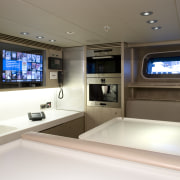 The crew mess is also equipped with a interior design, vehicle, yacht, brown, white