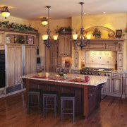 view of kitchen featuring cabinetry, wooden floors, countertops, cabinetry, countertop, cuisine classique, floor, flooring, hardwood, home, interior design, kitchen, room, wood, wood flooring, red, orange