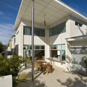 View of open-plan brick house with stainless steel architecture, daylighting, facade, home, house, real estate, roof, shade, gray