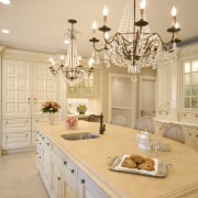 A calacutta marble tiled splashback and matching countertops cabinetry, ceiling, countertop, cuisine classique, estate, home, interior design, kitchen, room, window, orange