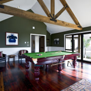 Traditional masonry home uses macrocarpa beams and floors billiard room, billiard table, ceiling, estate, hardwood, home, house, interior design, living room, pool, real estate, recreation room, room, table, window, wood, white