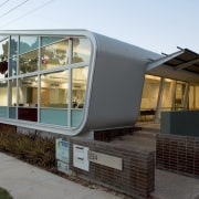 Image of the architectually designed Taylor Robinson building architecture, facade, home, house, real estate, gray, white, black