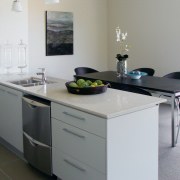 Interior view of the Kensington Park homes featuring countertop, cuisine classique, furniture, interior design, kitchen, product design, room, table, gray, white