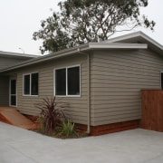 A1 Homes Beach Series house designed for coastal cottage, facade, home, house, property, real estate, residential area, roof, shed, siding, gray