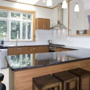 Dark cabinetry and black granite benchtop inside U-shaped cabinetry, countertop, cuisine classique, interior design, kitchen, real estate, room, gray, white, brown