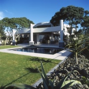 exterior view of house designed by Don Nelson architecture, arecales, estate, home, house, mansion, palm tree, property, real estate, resort, swimming pool, villa, black