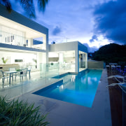 Bifold doors open to outdoor dining area and apartment, architecture, condominium, daylighting, estate, home, house, interior design, lighting, property, real estate, reflection, sky, swimming pool, villa, water, blue