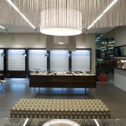 Image of Eyewear shop featuring cladding, cabinetry, tiled architecture, ceiling, daylighting, interior design, lobby, white