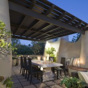 Working with an existing adobe look, designer Cameron outdoor structure, patio, pergola, real estate, roof, black