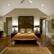 Master bedroom inside resort-style home with walls painted bedroom, ceiling, estate, floor, flooring, interior design, living room, real estate, room, suite, wall, wood flooring, brown