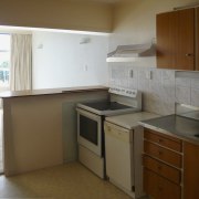 Image of the kitchen prior to renovations. - cabinetry, countertop, floor, hardwood, home, kitchen, property, real estate, room, brown