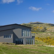 Exterior view of Jennian home custom built to cloud, cottage, elevation, farmhouse, grass, highland, hill, home, house, hut, land lot, landscape, mountain, property, real estate, roof, rural area, sky