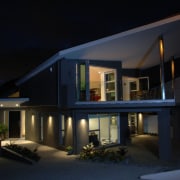 Night-time exterior view of contemporary home designed by architecture, building, elevation, estate, facade, home, house, landscape lighting, lighting, night, property, real estate, residential area, sky, window, black