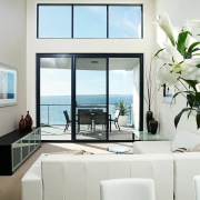Large balconies allow homeowners to enjoy views of furniture, home, interior design, living room, table, window, white